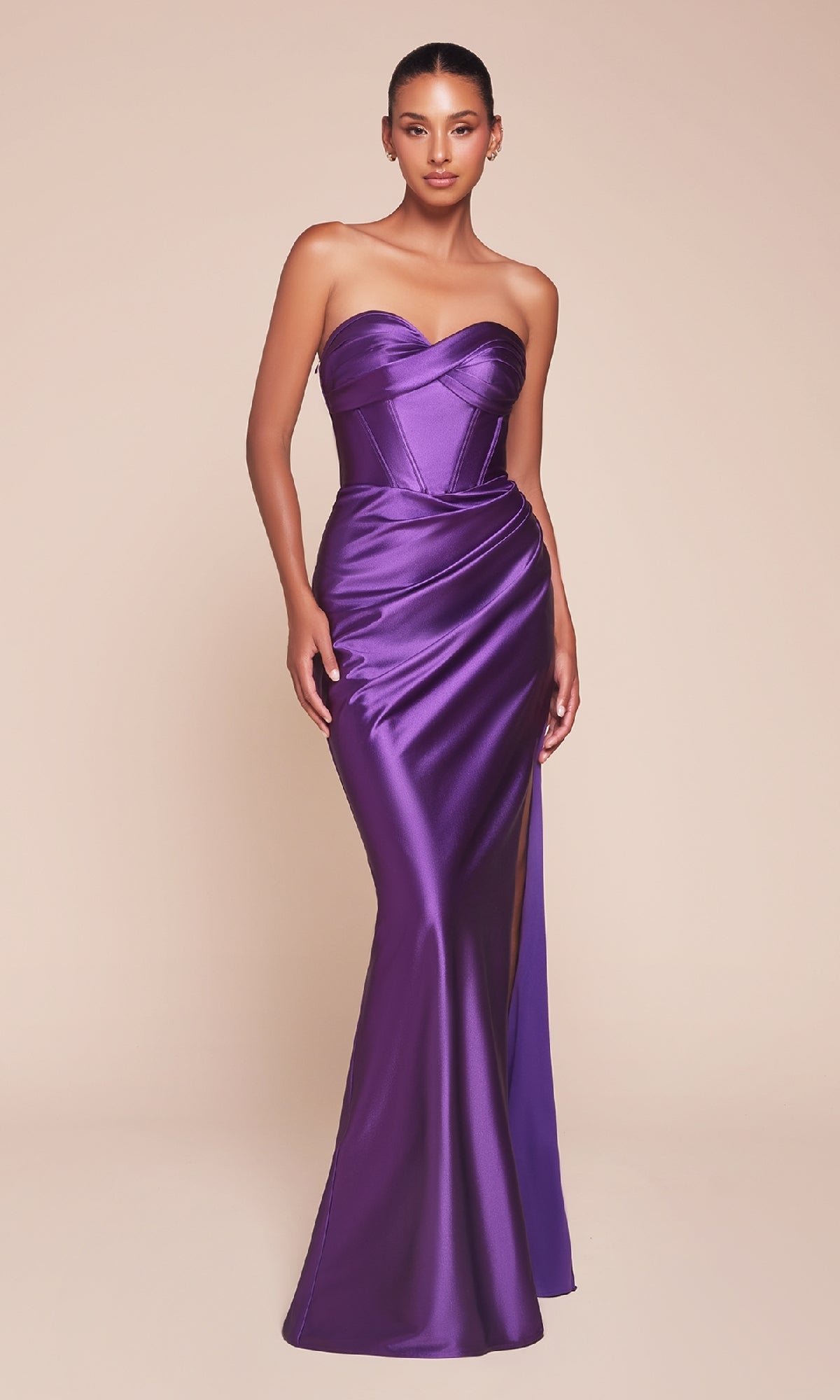 A woman models the Boned-Corset Strapless Long Prom Dress CD338 in purple satin, with a sweetheart neckline, boned corset bodice, and high slit.